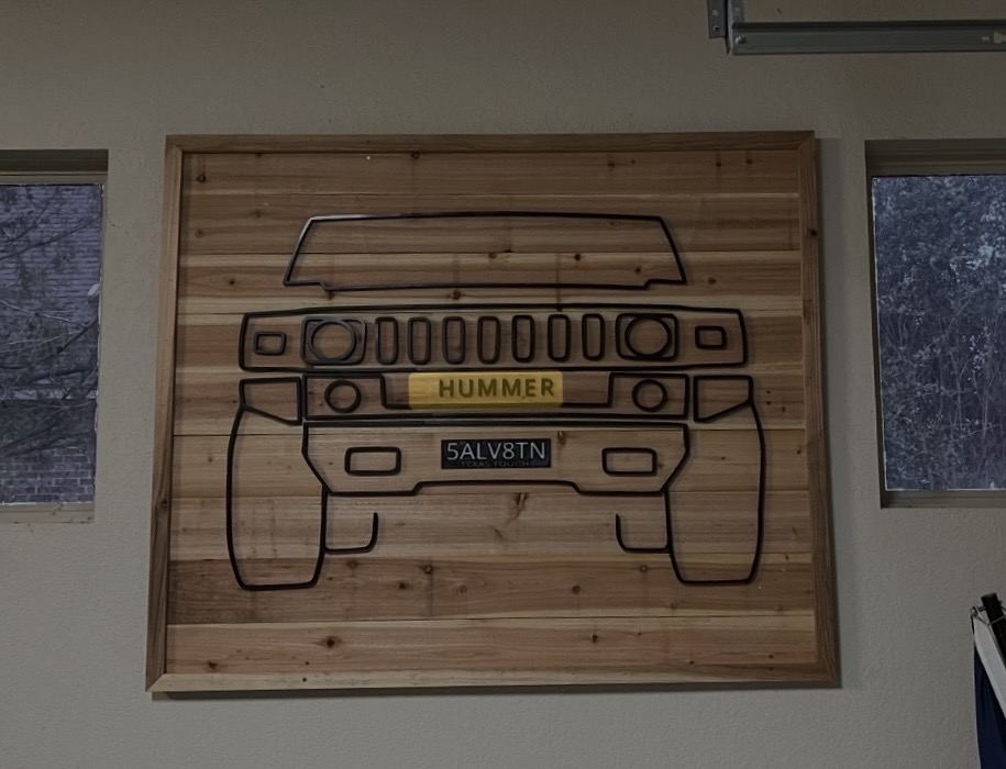 Laser-cut wood wall art with a Hummer H2 outline, HUMMER badge plate, and custom Texas license plate