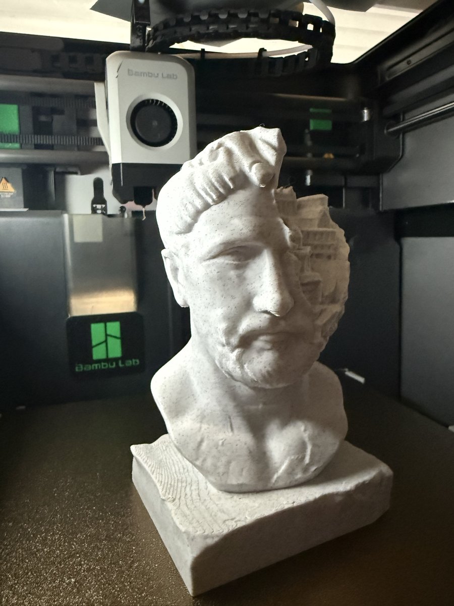 Roman bust 3D print with a miniature city and colosseum relief sculpted into the head, fresh off the print bed