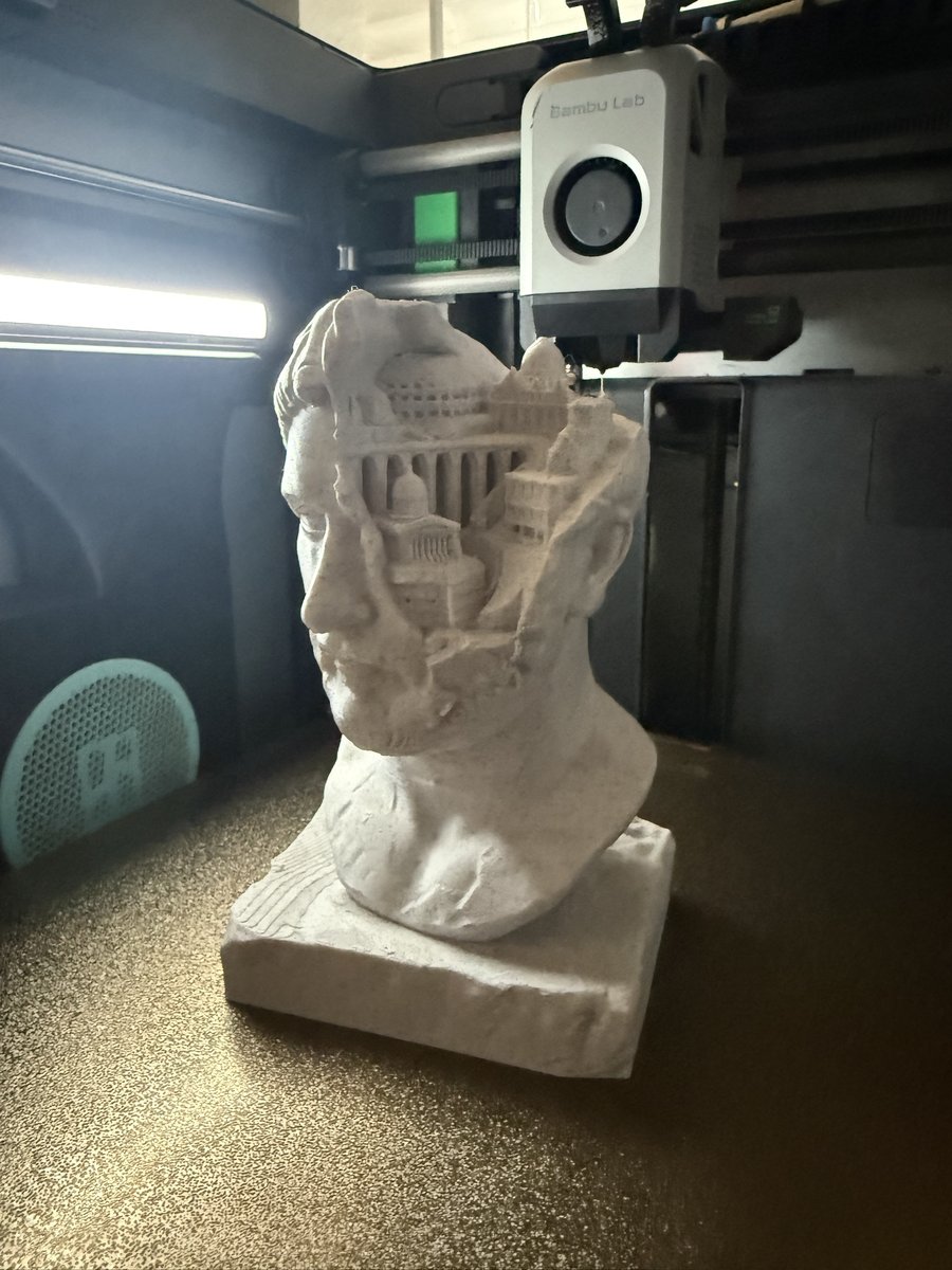 Close-up of the Roman bust print showing the architectural relief detail carved into the head